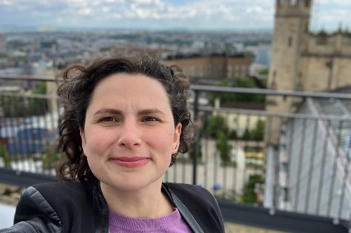 Image shows Dr Hannah Wakeford stood on the roof of the University's School of Physics